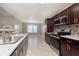 Well-equipped kitchen with stainless steel appliances, granite counters, and ample cabinet space at 1325 E 47Th St, Anderson, IN 46013