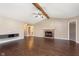 Bright living room with hardwood floors, fireplace, and views to the hall and kitchen at 1325 E 47Th St, Anderson, IN 46013