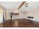 Open-concept living room with sliding doors, wood floors, and a kitchen view at 1325 E 47Th St, Anderson, IN 46013
