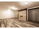 Spacious basement featuring modern flooring and stone fireplace, great for entertaining at 1401 Castle Ave, Indianapolis, IN 46227