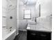 Well-lit bathroom with a modern sink, granite countertop, and subway tile backsplash at 1401 Castle Ave, Indianapolis, IN 46227