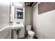 Compact basement bathroom with standard fixtures and essential amenities at 1401 Castle Ave, Indianapolis, IN 46227