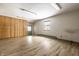 Bonus room with light wood flooring, built-in storage, and a bright window at 1401 Castle Ave, Indianapolis, IN 46227