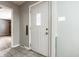 Inviting foyer featuring tiled floors and a paneled front door, great natural lighting at 1401 Castle Ave, Indianapolis, IN 46227