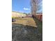An average-sized backyard with a trash can and some weeds at 1610 Central Ave, Anderson, IN 46016