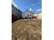Backyard with some weeds and trash cans at 1610 Central Ave, Anderson, IN 46016
