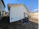 Backyard view of the side of the house with garbage cans at 1610 Central Ave, Anderson, IN 46016