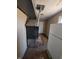 Basement area featuring a black furnace with visible ductwork and a white refrigerator at 1628 Sherman St, Anderson, IN 46016