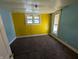 Bedroom with colorful walls, carpet, and room for relaxation at 1628 Sherman St, Anderson, IN 46016