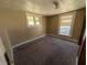 Neutral bedroom featuring carpet, window bringing in light, and room for relaxation at 1628 Sherman St, Anderson, IN 46016