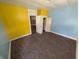 Colorful bedroom featuring carpet, closet, and a cheerful atmosphere at 1628 Sherman St, Anderson, IN 46016