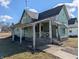 Vintage exterior showcases a porch with awning, and a traditional design, needs TLC at 1628 Sherman St, Anderson, IN 46016