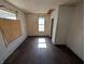 Sunny bedroom with hardwood floors and a bright window at 1709 Central Ave, Anderson, IN 46016