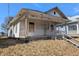 Exterior view of home featuring a cozy covered front porch at 1709 Central Ave, Anderson, IN 46016