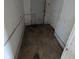 Hallway with tiled floor, peeling paint, and an entryway to a room at 1709 Central Ave, Anderson, IN 46016