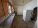 Kitchen featuring a refrigerator, double basin sink and window at 1709 Central Ave, Anderson, IN 46016