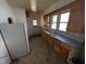 Kitchen with wood cabinets, double basin sink and appliances at 1709 Central Ave, Anderson, IN 46016