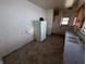 Bright kitchen with a refrigerator and a window view at 1709 Central Ave, Anderson, IN 46016