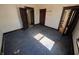 Sunlit room featuring vintage details, hardwood floors, and multiple doorways, creating a spacious layout at 1709 Central Ave, Anderson, IN 46016