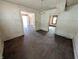 Spacious living room featuring hardwood floors, wainscoting, and open doorways at 1709 Central Ave, Anderson, IN 46016