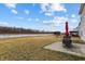 Expansive backyard with a view of the water, patio area and outdoor seating at 2091 Creek Bank Dr, Columbus, IN 47201