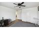 Bright bedroom featuring a ceiling fan, carpet, and white trim at 2091 Creek Bank Dr, Columbus, IN 47201
