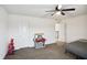 Bright bedroom with neutral carpet, ceiling fan, and white trim offers a cozy space at 2091 Creek Bank Dr, Columbus, IN 47201