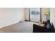 Bedroom with a view of the lake, featuring large window, and dark-colored sofa at 2091 Creek Bank Dr, Columbus, IN 47201