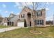 Charming two-story brick home with a well-manicured lawn and inviting curb appeal at 2091 Creek Bank Dr, Columbus, IN 47201