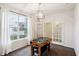 Well-lit game room with a foosball table, neutral walls, and large windows at 2091 Creek Bank Dr, Columbus, IN 47201