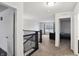 Upstairs hallway featuring a black-stained wood banister at 2091 Creek Bank Dr, Columbus, IN 47201