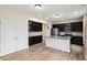 Bright kitchen with dark cabinets, stainless steel appliances, and a granite-topped island at 2091 Creek Bank Dr, Columbus, IN 47201