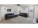 Spacious living room with comfortable seating and a view of the pond with natural light at 2091 Creek Bank Dr, Columbus, IN 47201