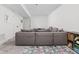 Finished basement featuring neutral walls, plush carpet, and a large sectional sofa at 2117 Broadway St, Indianapolis, IN 46202