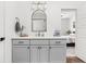 Bathroom featuring white cabinets, quartz countertop, and a modern sink with access to the bedroom at 2117 Broadway St, Indianapolis, IN 46202