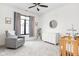 Inviting Bedroom featuring a crib, rocking chair, and soft, neutral decor at 2117 Broadway St, Indianapolis, IN 46202