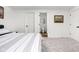 Bedroom featuring neutral walls, plush carpet, and access to the ensuite bathroom at 2117 Broadway St, Indianapolis, IN 46202