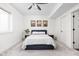Cozy bedroom with a queen bed, soft carpet, and a ceiling fan at 2117 Broadway St, Indianapolis, IN 46202