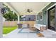 Inviting covered patio with ceiling fan, outdoor kitchen, and a comfortable seating area at 2117 Broadway St, Indianapolis, IN 46202