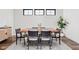 Elegant dining room with a wood table, seating for six, and a decorative rug at 2117 Broadway St, Indianapolis, IN 46202