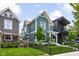 Charming two-story home boasts lush lawn, landscaping, and a welcoming front entrance with a well-manicured lawn at 2117 Broadway St, Indianapolis, IN 46202