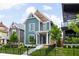Charming two-story home boasts lush lawn, landscaping, and a welcoming front entrance with a well-manicured lawn at 2117 Broadway St, Indianapolis, IN 46202