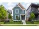 Charming two-story home boasts lush lawn, landscaping, and a welcoming front entrance with a well-manicured lawn at 2117 Broadway St, Indianapolis, IN 46202