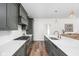 Modern kitchen boasts stainless steel appliances, ample counter space, and stylish gray cabinets at 2117 Broadway St, Indianapolis, IN 46202