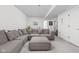 Spacious living room with a large sectional sofa and comfortable carpeting at 2117 Broadway St, Indianapolis, IN 46202