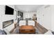 Open-concept living room flows into modern kitchen with large island, dining area, and hardwood flooring at 2117 Broadway St, Indianapolis, IN 46202