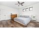 Inviting bedroom with modern decor, a ceiling fan, and three windows providing natural light at 2117 Broadway St, Indianapolis, IN 46202