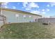 The backyard of the home is enclosed with a wooden fence, offering privacy at 2243 E Werges Ave, Indianapolis, IN 46237
