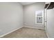 Cozy bedroom features plush carpeting and window offering natural light at 2243 E Werges Ave, Indianapolis, IN 46237