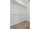 Walk-in closet showing multiple levels of white shelving and hanging rods, maximizing storage space at 2243 E Werges Ave, Indianapolis, IN 46237